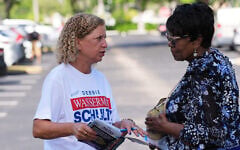 US Representative Debbie Wasserman Schultz, left, greets voters while campaigning for Florida’s 20th congressional district in the Florida primary election, August 18, 2026, in Tamarac, Florida. (AP Photo/Lynne Sladky)