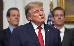 US President Donald Trump listens as Gemini co-founder and president Cameron Winklevoss, left, and Gemini co-founder and CEO Tyler Winklevoss, right, watch, during a meeting with technology leaders in the Roosevelt Room of the White House, August 19, 2026, in Washington. (AP Photo/Jacquelyn Martin)