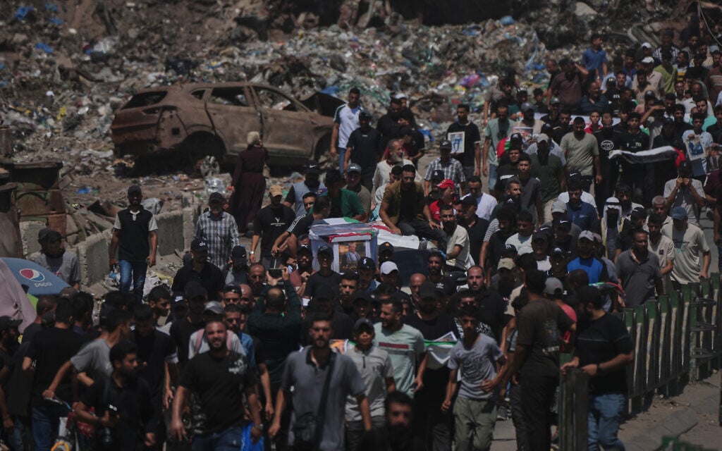 Mourners carry the flag-draped bodies of Palestinians killed in Israeli strikes during the war with Hamas, whose remains were recently recovered from the rubble, in Gaza City, August 20, 2026. (AP Photo/Jehad Alshrafi) Mourners carry the flag-draped bodies of Palestinians killed in Israeli strikes during the war with Hamas, whose remains were recently recovered from the rubble, in Gaza City, August 20, 2026. (AP Photo/Jehad Alshrafi)