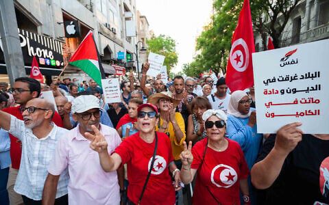 People take part in a protest against rising prices, declining purchasing power and shortages of basic goods in Tunis, Tunisia, August 20, 2026. (AP Photo/Ons Abid)