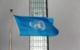 The UN flag flies on a stormy day at the United Nations during the United Nations General Assembly, September 22, 2022. (AP Photo/Ted Shaffrey)