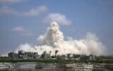 The Israeli army demolishes buildings east of Deir al-Balah, central Gaza Strip, August 22, 2026. (AP Photo/Abdel Kareem Hana)