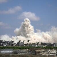 The Israeli army demolishes buildings east of Deir al-Balah, central Gaza Strip, August 22, 2026. (AP Photo/Abdel Kareem Hana)