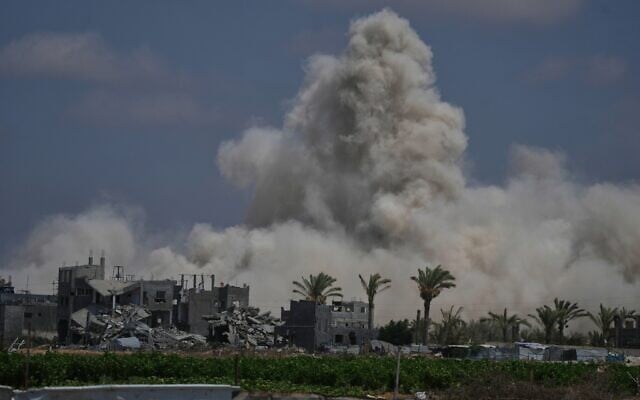 The Israeli army demolishes buildings east of Deir al-Balah, central Gaza Strip, August 22, 2026. (AP Photo/Abdel Kareem Hana)