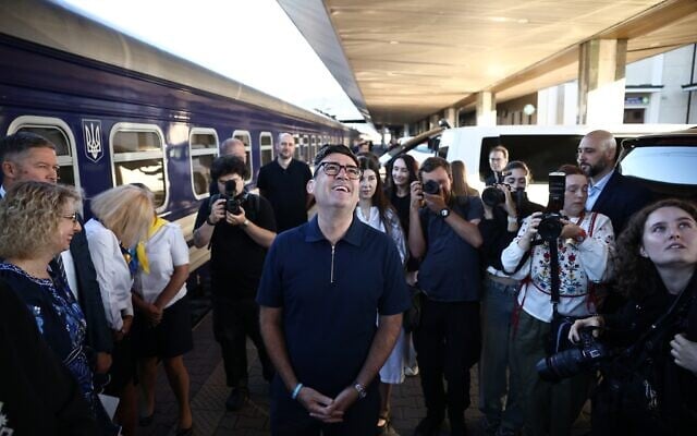 Britain’s prime minister Andy Burnham, center, smiles upon his arrival by train, in Kyiv, August 24, 2026. (Henry Nicholls/Pool Photo via AP)