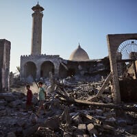 Palestinians inspect the Abu Salim Mosque a day after it was hit by an Israeli airstrike, in Deir al-Balah, central Gaza Strip, August 25, 2026. (AP Photo/Abdel Kareem Hana)