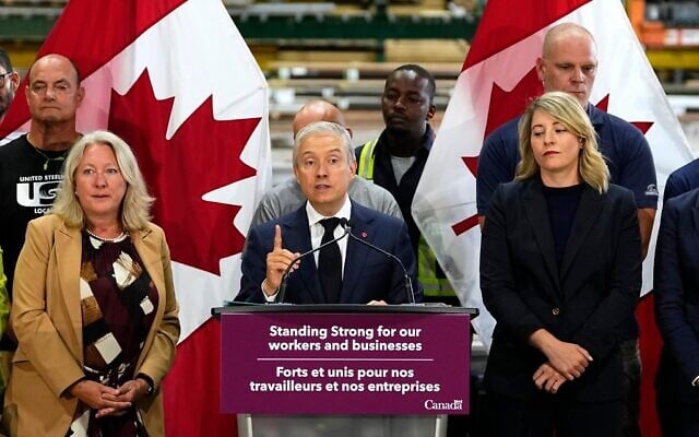 Canadian Minister of Finance and National Revenue Francois-Philippe Champagne speaks at a news conference on Canada’s response to US tariffs, at a roofing company in Ottawa, on August 25, 2026. (Justin Tang/The Canadian Press via AP)