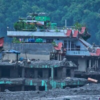 Damage is seen in the aftermath of flash floods in Devighat in the Nuwakot district in Nepal, August 27, 2026. (AP/Niranjan Shrestha)