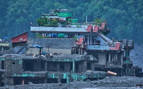 Damage is seen in the aftermath of flash floods in Devighat in the Nuwakot district in Nepal, August 27, 2026. (AP/Niranjan Shrestha)