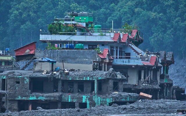 Damage is seen in the aftermath of flash floods in Devighat in the Nuwakot district in Nepal, August 27, 2026. (AP/Niranjan Shrestha)