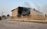 Smoke rises from a building damaged in a strike in Lamerd, southern Iran, February 28, 2026. (Alireza Ameri/Tasnim News Agency via AP)
