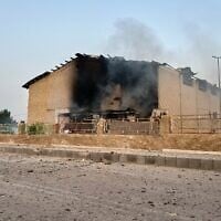 Smoke rises from a building damaged in a strike in Lamerd, southern Iran, February 28, 2026. (Alireza Ameri/Tasnim News Agency via AP)