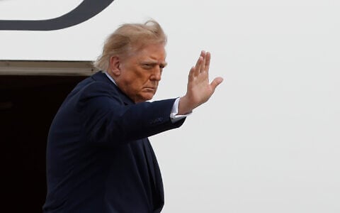President Donald Trump waves from the stairs of Air Force One upon his departure at Joint Base Andrews, Md., August 27, 2026. (AP Photo/Luis M. Alvarez)