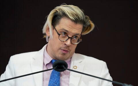 Milo Yiannopoulos speaks during a rally outside of the Baltimore hotel where the United States Conference of Catholic Bishops are holding its Fall General Assembly meeting in Baltimore, November 16, 2021. (AP Photo/Julio Cortez)