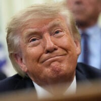 US President Donald Trump smiles during an event about drug prices, in the Oval Office of the White House, August 31, 2026, in Washington. (AP Photo/Jacquelyn Martin)