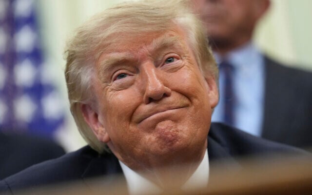 US President Donald Trump smiles during an event about drug prices, in the Oval Office of the White House, August 31, 2026, in Washington. (AP Photo/Jacquelyn Martin)