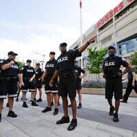 Toronto police meet in front of the Rogers Centre before the opening ceremony for the Pan Am Games in Toronto, July 10, 2015. (AP/Gregory Bull)