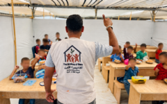 A teacher educates children at the al-Mawasi camp in the Gaza Children's Village. (Courtesy)