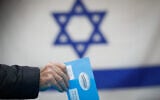File: A ballot is cast at a voting station in Jerusalem, during the Knesset election, on March 2, 2020. (Olivier Fitoussi/Flash90)