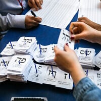 Illustrative: Ballots are counted at the Knesset in Jerusalem, a day after the general elections, March 4, 2020. (Olivier Fitoussi/Flash90)