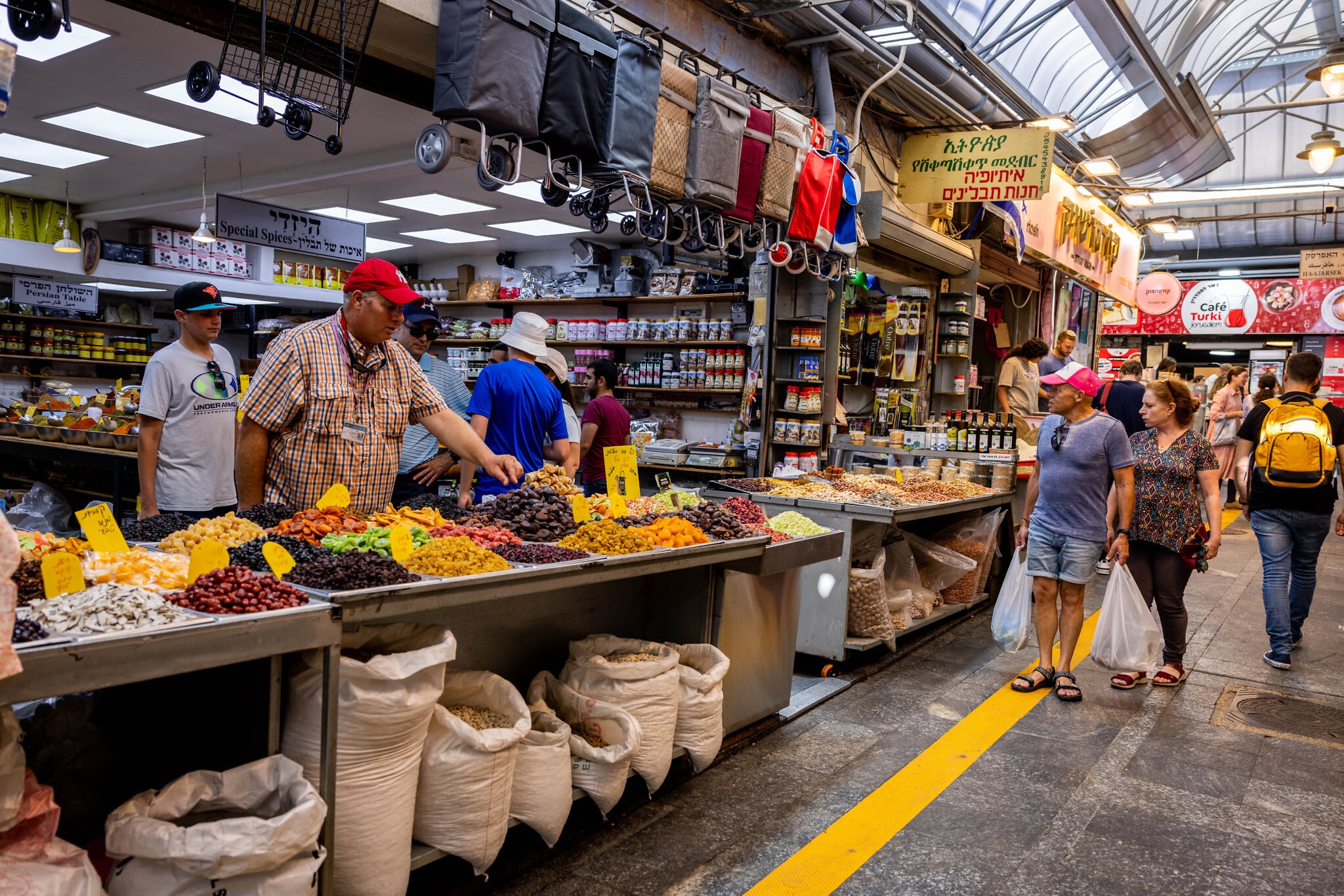 People at the Mahane Yehuda market in Jerusalem, July 21, 2022. (Nati Shohat/Flash90) People at the Mahane Yehuda market in Jerusalem, July 21, 2022. (Nati Shohat/Flash90)