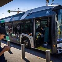 Illustrative: A Superbus driver waits for passengers at the entrance to Jerusalem, August 1, 2022. (Olivier Fitoussi/Flash90)