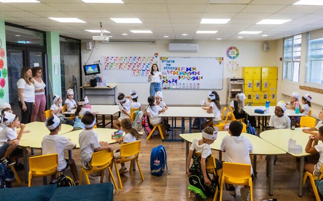 First graders sit in their classroom on the first day of school in Jerusalem, September 1, 2025. (Chaim Goldberg/Flash90)