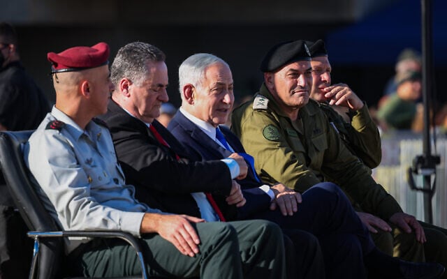 Defense Minister Israel Katz,  second left, Prime Minister Benjamin Netanyahu, second right, and IDF Chief of Staff Lt. Gen. Eyal Zamir attend the graduation ceremony of an IDF officers’ course in southern Israel, June 25, 2026. (Flash90)