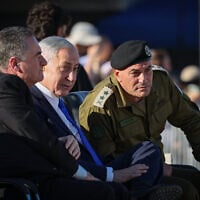 Prime Minister Benjamin Netanyahu, Defense Minister Israel Katz, and IDF Chief of Staff Lt. Gen. Eyal Zamir attend the graduation ceremony of an IDF officers’ course in southern Israel, June 25, 2026. (Flash90)
