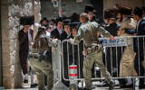 Ultra-Orthodox protesters clash with police during a protest against a cafe operating on Shabbat in central Jerusalem, July 25, 2026. (Yonatan Sindel/Flash90)