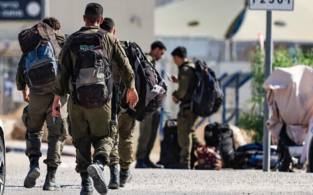 IDF soldiers are seen outside the Sde Teiman military base near Beersheba, July 30, 2026. (Tsafrir Abayov/Flash90)