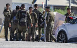 Israeli soldiers are seen outside the Sde Teiman military base near Beersheba, southern Israel, July 30, 2026. (Tsafrir Abayov/Flash90)