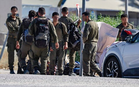 Israeli soldiers are seen outside the Sde Teiman military base near Beersheba, southern Israel, July 30, 2026. (Tsafrir Abayov/Flash90)