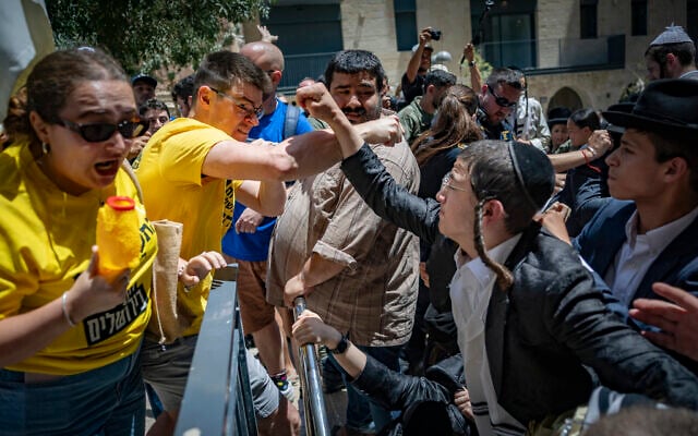 Ultra-Orthodox protesters demonstrate against a cafe operating on Shabbat and clash with Israeli police, while secular protesters hold a counter-demonstration in support of the cafe in central Jerusalem, August 1, 2026. (Yonatan Sindel/Flash90)