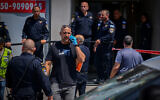 Police work outside the law firm where a lawyer was shot dead on August 4, 2026. (Avshalom Sassoni/FLASH90)