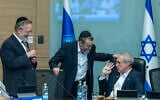 Finance Committee chair MK Hanoch Milwidsky, right, speaks with MKs Moshe Gafni, center, and Yitzhak Pindrus during a Knesset Finance Committee meeting in Jerusalem, August 4, 2026. (Chaim Goldberg/Flash90)