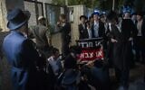 Ultra-Orthodox protesters demonstrate against an IDF recruitment conference for the Haredi community in Jerusalem, August 4, 2026. (Chaim Goldberg/Flash90)