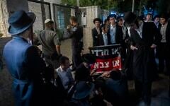 Ultra-Orthodox protesters demonstrate against an IDF recruitment conference for the Haredi community in Jerusalem, August 4, 2026. (Chaim Goldberg/Flash90)