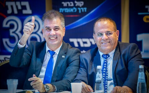 Energy Minister Eli Cohen (L) and former MK Ayoub Kara attend a Likud party conference ahead of the party’s primary election in the northern city of Haifa, August 4, 2026. (Sharon Leibel/Flash90)