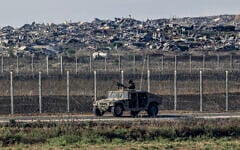 Israeli soldiers seen on the Israeli border with the Gaza Strip, August 5, 2026. (Tsafrir Abayov/Flash90)