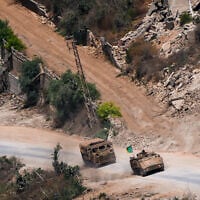 Israeli soldiers are seen inside southern Lebanon from the Israeli side of the border, August 6, 2026. (Ayal Margolin/Flash90)