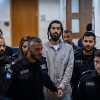 Administrative detainee Tal Yinon Dardik, who is on a hunger strike in prison, arrives at the Jerusalem District Court for a hearing on Central Command chief Maj. Gen. Avi Bluth’s appeal against a decision to release him from administrative detention, August 6, 2026. (Chaim Goldberg/Flash90)
