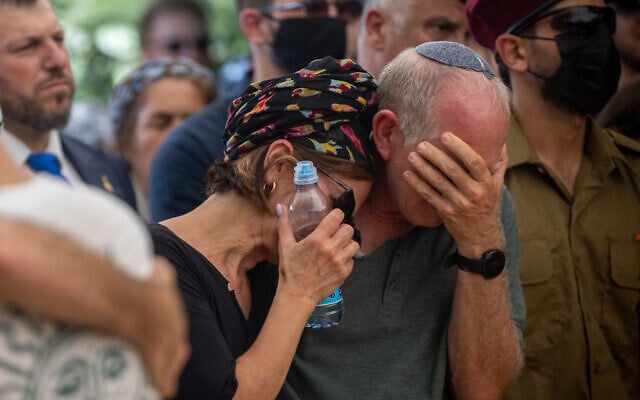 The parents of Maj. (Res.) Harel Birenstock, 34, who was killed in action during combat in southern Lebanon, mourn him at his funeral on Mount Herzl in Jerusalem. August 6, 2026. (Yonatan Sindel/FLASH90)