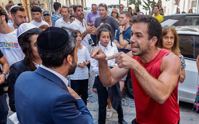 Ultra-Orthodox protesters demonstrate against a cafe operating on Shabbat and clash with Israeli police, while secular protesters hold a counter-demonstration in support of the cafe in central Jerusalem, August 8, 2026. (Oren Ben Hakoon/Flash90)