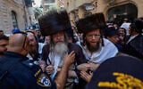 Ultra-Orthodox protesters demonstrate against a cafe operating on Shabbat and clash with Israeli police in central Jerusalem, August 8, 2026. (Oren Ben Hakoon/Flash90)
