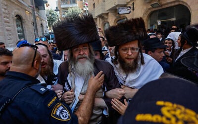Ultra-Orthodox protesters demonstrate against a cafe operating on Shabbat and clash with Israeli police in central Jerusalem, August 8, 2026. (Oren Ben Hakoon/Flash90)