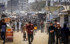 Illustrative: Palestinians in Khan Younis, the southern Gaza Strip, August 12, 2026. (Abed Rahim Khatib/FLASH90)