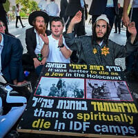 Haredi Jews block traffic during a protest against the arrest of an ultra-Orthodox draft dodger, on Route 4 near Bnei Brak, August 12, 2026. (Avshalom Sassoni/Flash90)