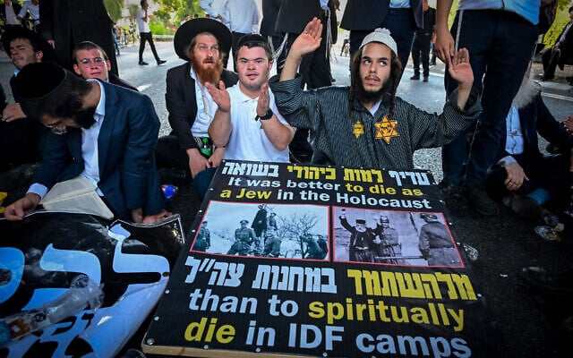 Haredi Jews block traffic during a protest against the arrest of an ultra-Orthodox draft dodger, on Route 4 near Bnei Brak, August 12, 2026. (Avshalom Sassoni/Flash90)
