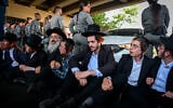 Ultra-Orthodox men clash with police during a protest against military enlistment, Bnei Brak, August 8, 2026. (Avshalom Sassoni/Flash90)
